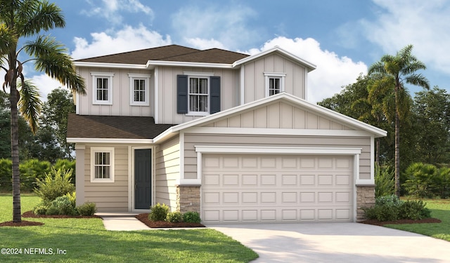 view of front facade featuring a front yard and a garage