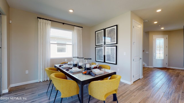 dining room with light hardwood / wood-style flooring