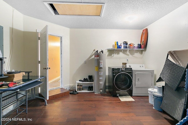 laundry room featuring water heater, separate washer and dryer, dark hardwood / wood-style floors, and a textured ceiling