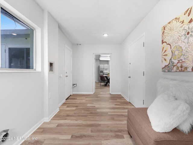 hall featuring light wood-type flooring