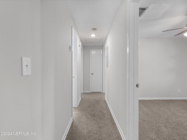 hallway with light colored carpet