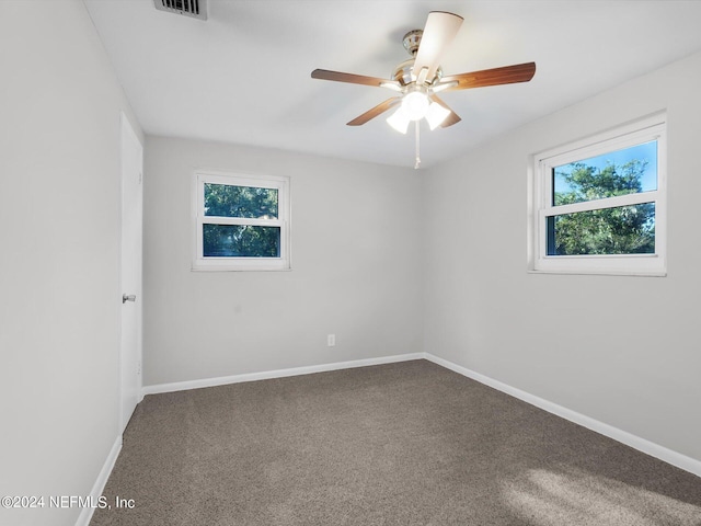 empty room with carpet and ceiling fan