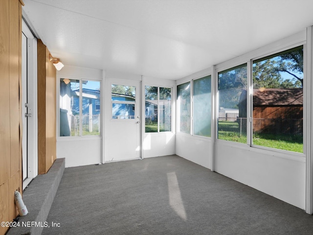 unfurnished sunroom with plenty of natural light