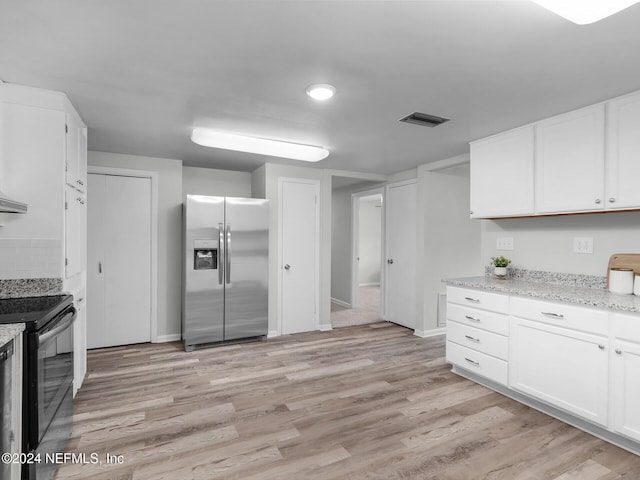 kitchen with black electric range, light stone countertops, stainless steel refrigerator with ice dispenser, light hardwood / wood-style floors, and white cabinets