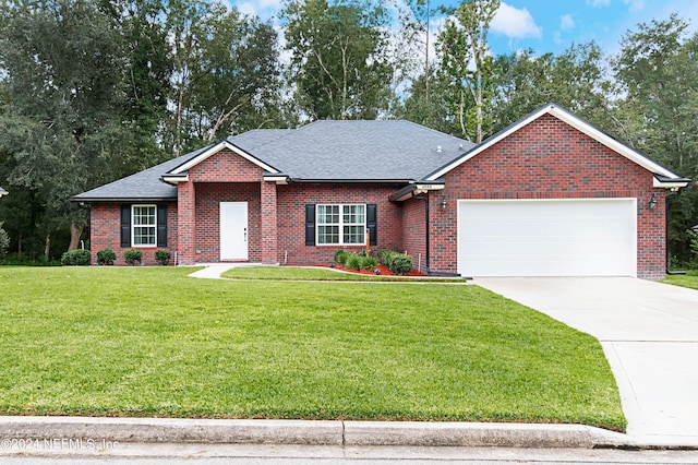 ranch-style house featuring a garage and a front lawn