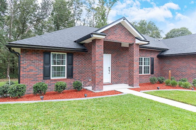 view of front of home with a front lawn