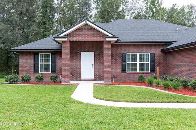 single story home with a front yard