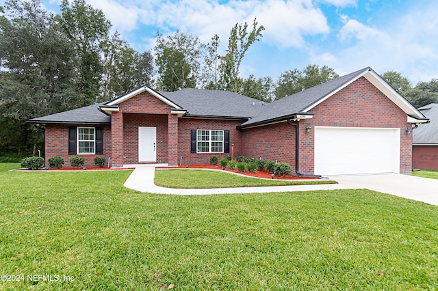 ranch-style house featuring a garage and a front lawn