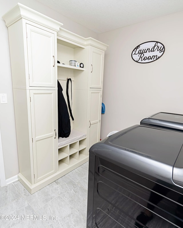 laundry room with cabinets