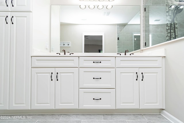 bathroom with vanity, walk in shower, and tile patterned floors