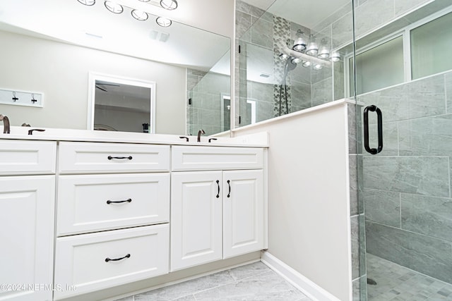 bathroom featuring vanity and an enclosed shower