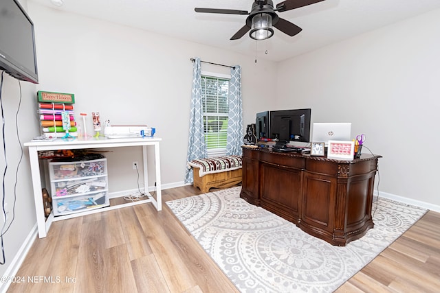 office area with light hardwood / wood-style floors and ceiling fan