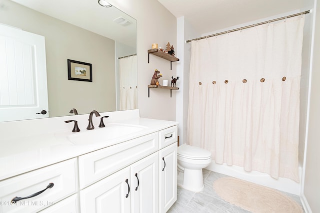 full bathroom with vanity, toilet, tile patterned floors, and shower / bath combo