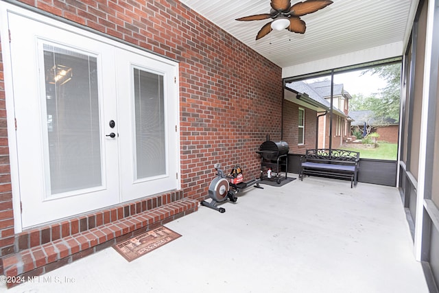 sunroom featuring french doors and ceiling fan