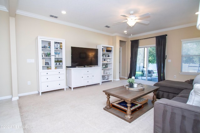 living room with crown molding and ceiling fan