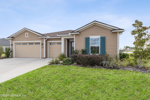 view of front facade with a front lawn and a garage