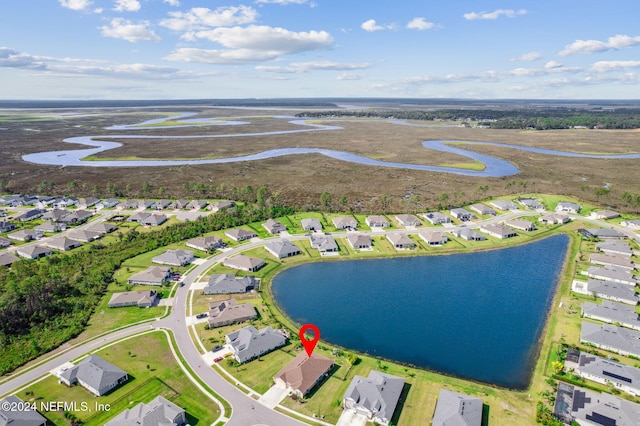 bird's eye view with a residential view and a water view