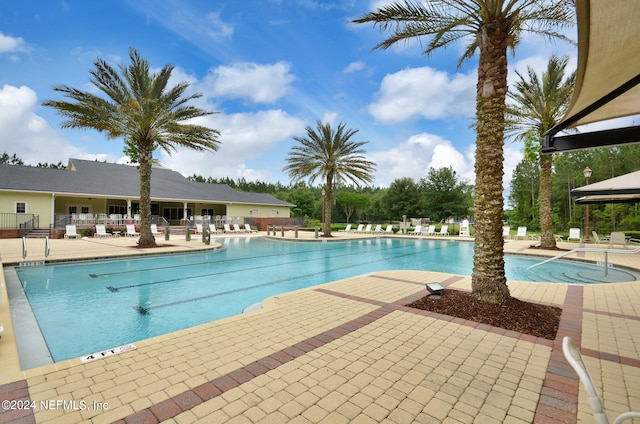 view of swimming pool featuring a patio area