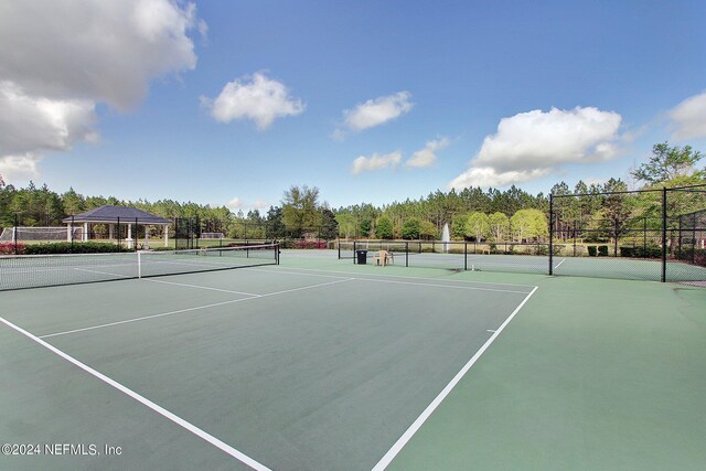 view of sport court featuring fence and community basketball court