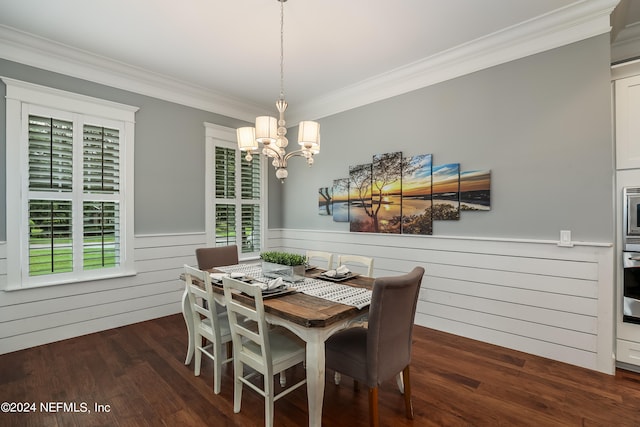 dining area featuring a chandelier, crown molding, and dark hardwood / wood-style flooring