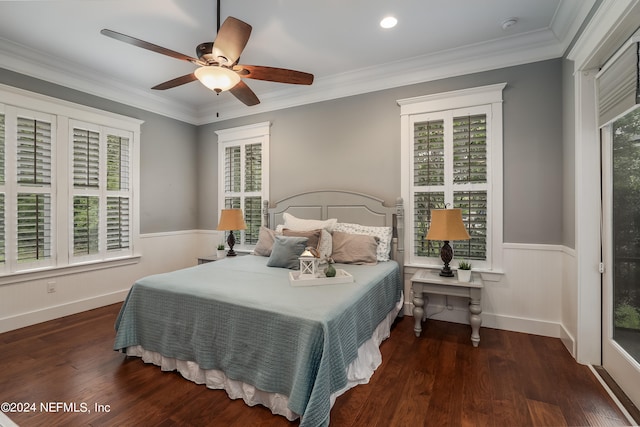 bedroom featuring dark wood-type flooring, crown molding, and ceiling fan