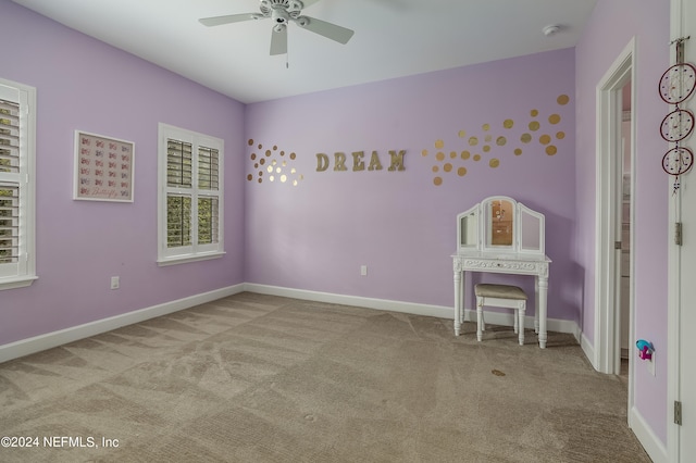 unfurnished bedroom featuring carpet and ceiling fan