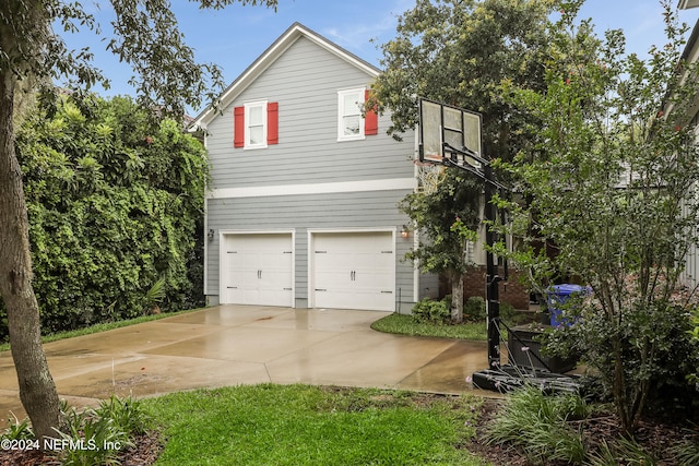 view of side of property with a garage