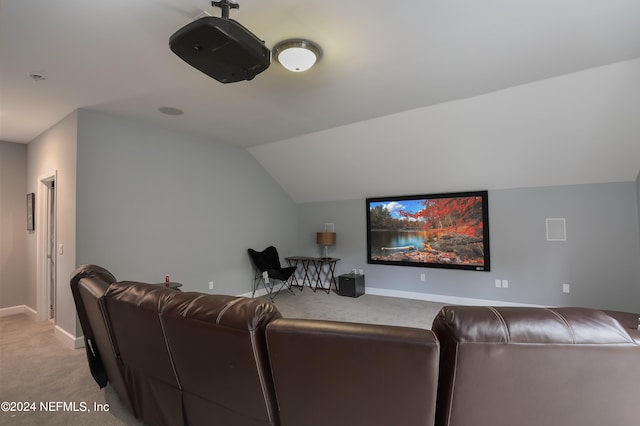 cinema room with light carpet and lofted ceiling