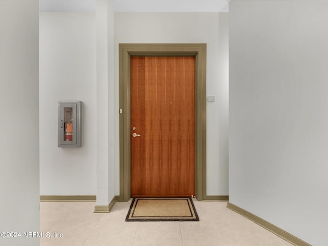 entryway featuring light tile patterned floors