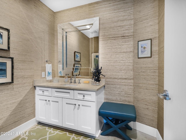 bathroom featuring tile patterned flooring and vanity