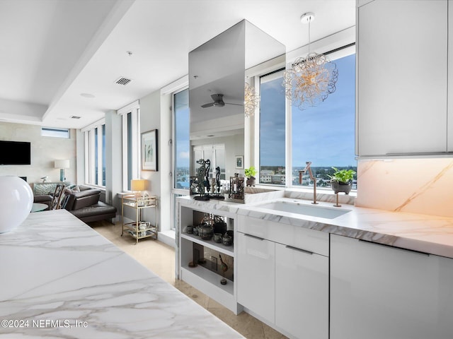 bedroom featuring a notable chandelier and sink