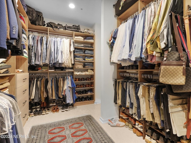 walk in closet featuring carpet