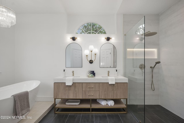 bathroom with vanity, independent shower and bath, and tile patterned flooring