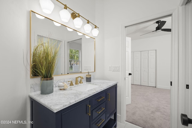 bathroom featuring vanity and ceiling fan