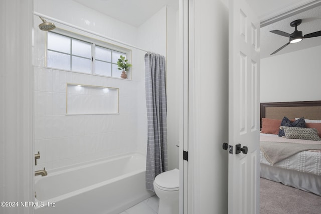 bathroom featuring ceiling fan, toilet, and shower / bathtub combination with curtain