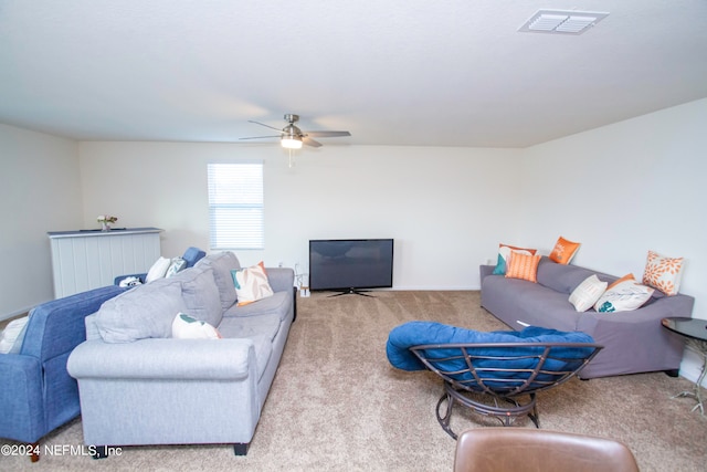 living room with ceiling fan and light carpet