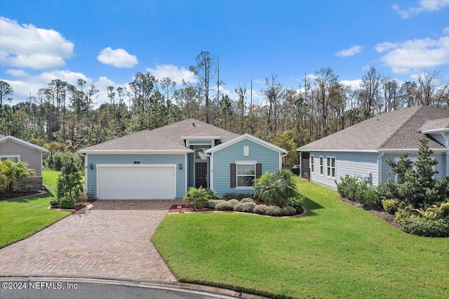 ranch-style home with a front yard and a garage