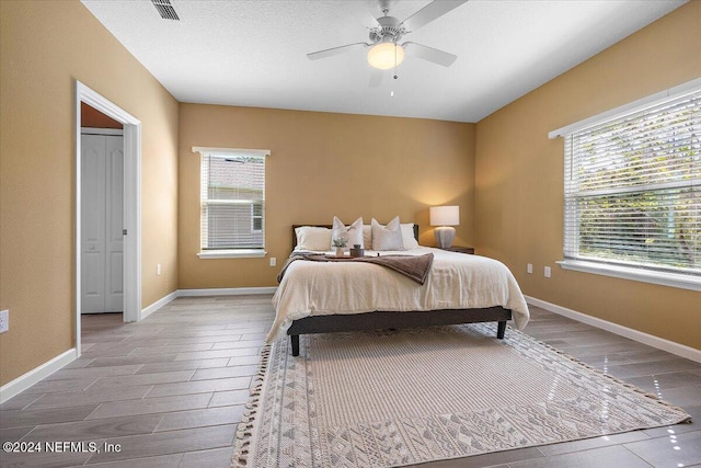 bedroom featuring hardwood / wood-style flooring and ceiling fan