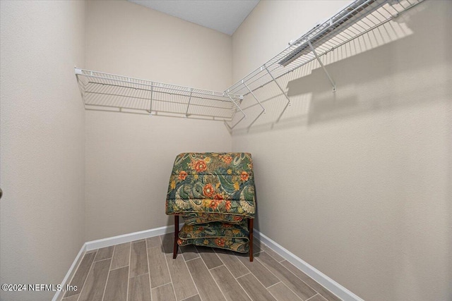 spacious closet featuring hardwood / wood-style floors