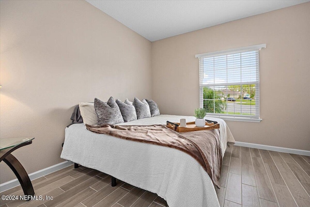 bedroom featuring wood-type flooring