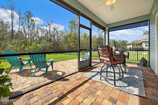 sunroom / solarium with ceiling fan