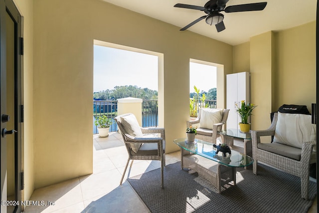 view of patio / terrace with an outdoor hangout area, a water view, and ceiling fan