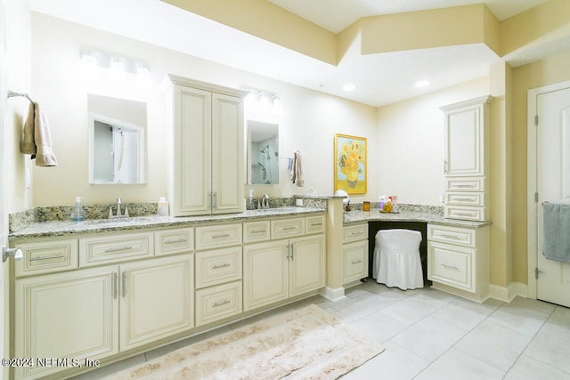 bathroom with vanity and tile patterned flooring