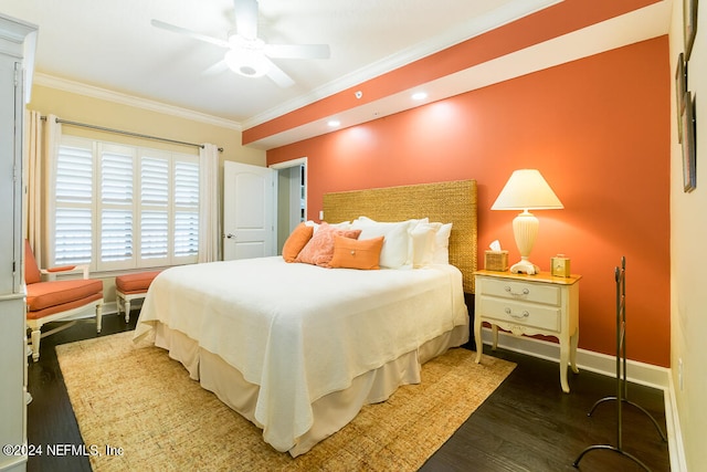 bedroom with dark wood-type flooring, crown molding, and ceiling fan