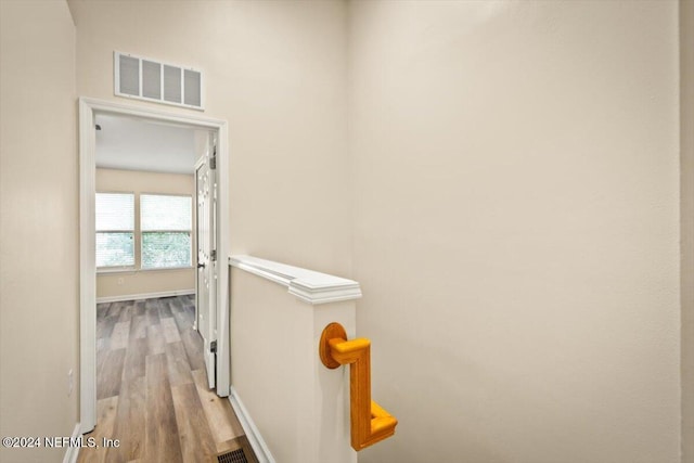 8121 Summer Palm Ct, Jacksonville, FL 32256 - hallway featuring baseboards, wood finished floors, and visible vents