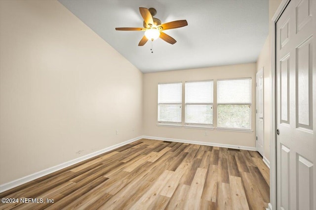 8121 Summer Palm Ct, Jacksonville, FL 32256 - unfurnished room featuring lofted ceiling, wood finished floors, baseboards, and ceiling fan
