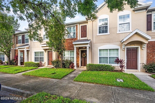 8121 Summer Palm Ct, Jacksonville, FL 32256 - multi unit property featuring stucco siding and a front yard