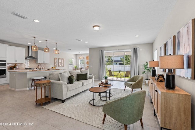 tiled living room with a textured ceiling