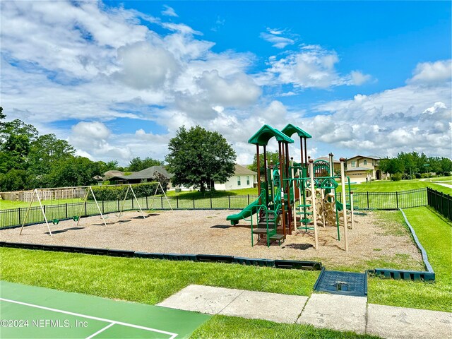 view of playground with a yard