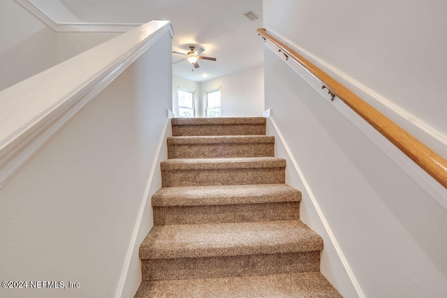 stairway with ceiling fan